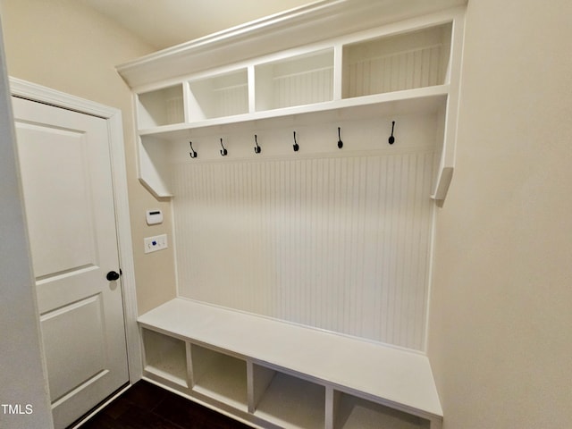 mudroom with dark wood-style flooring