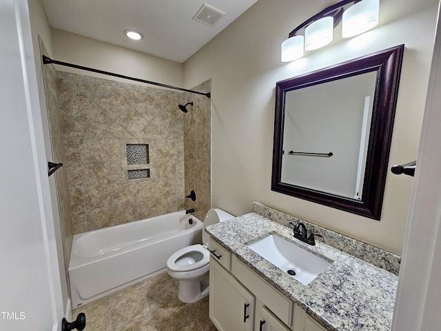 bathroom featuring visible vents, toilet, shower / bath combination, and vanity