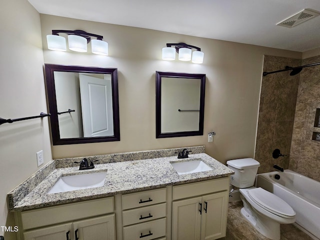 full bath featuring double vanity, toilet, visible vents, and a sink