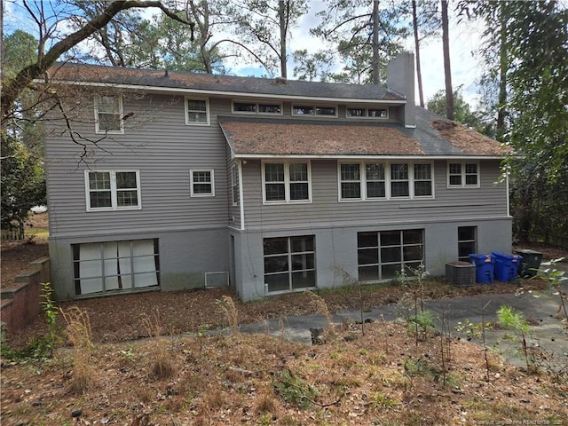 back of property featuring a chimney