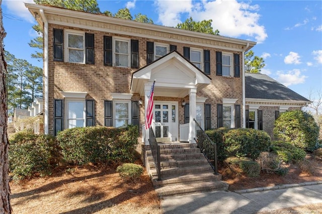 view of front of home with brick siding