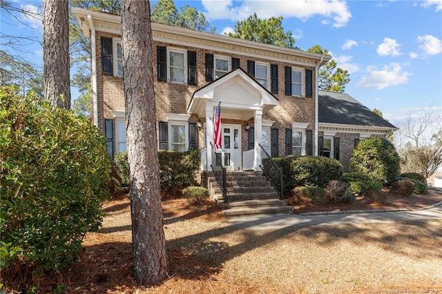 view of front of house with brick siding