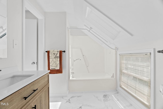 bathroom featuring marble finish floor, vanity, shower / bathing tub combination, and baseboards