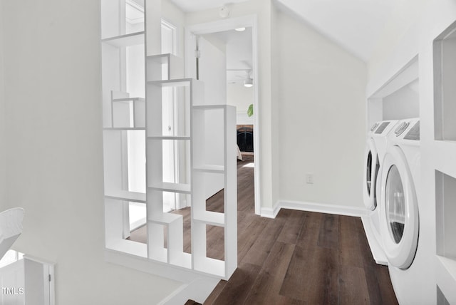 washroom featuring a ceiling fan, baseboards, dark wood finished floors, laundry area, and washing machine and dryer