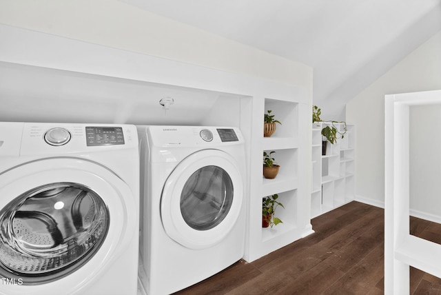 washroom with baseboards, separate washer and dryer, wood finished floors, and laundry area