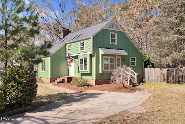 view of front of property with a shingled roof, fence, a chimney, and crawl space