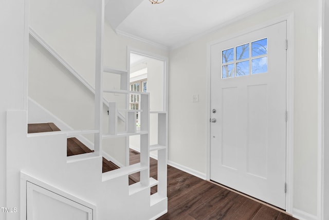 foyer with stairway, ornamental molding, baseboards, and wood finished floors