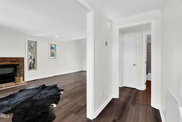 living area with visible vents, baseboards, and wood finished floors