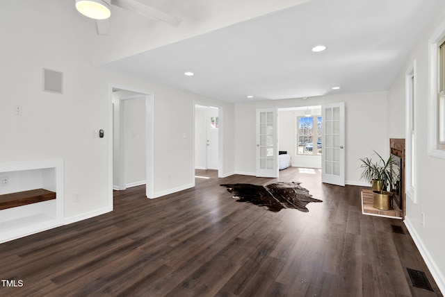 interior space with visible vents, recessed lighting, french doors, baseboards, and dark wood-style flooring