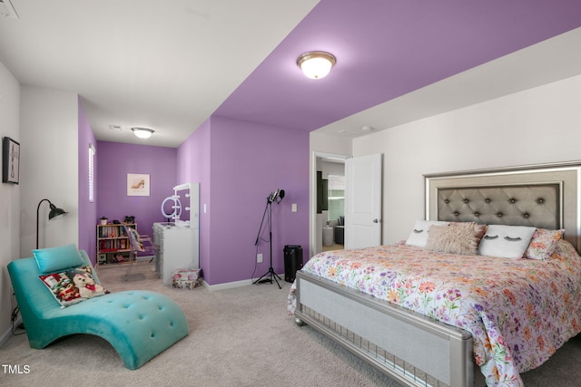 carpeted bedroom featuring baseboards