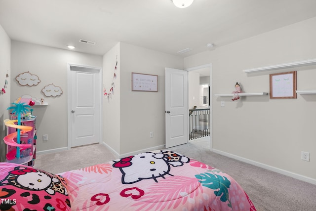 bedroom featuring light carpet, visible vents, and baseboards