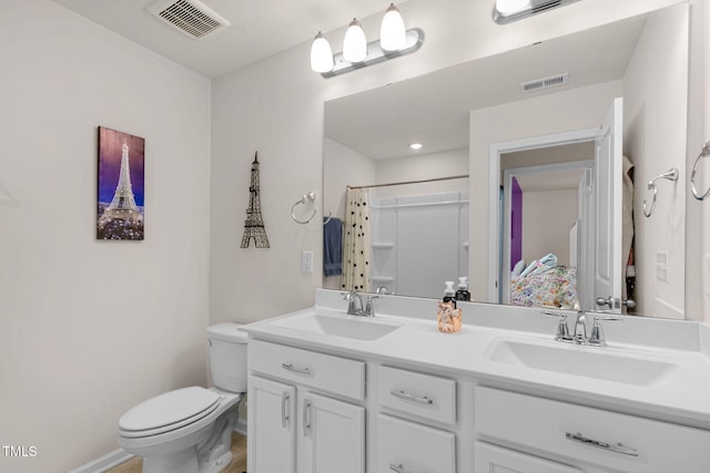 bathroom with a sink, visible vents, curtained shower, and toilet