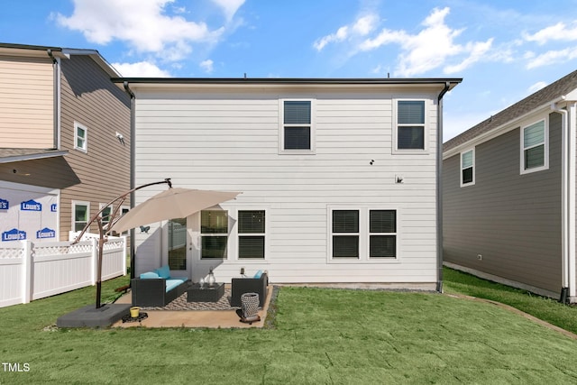 back of house featuring a patio, a yard, fence, and an outdoor hangout area