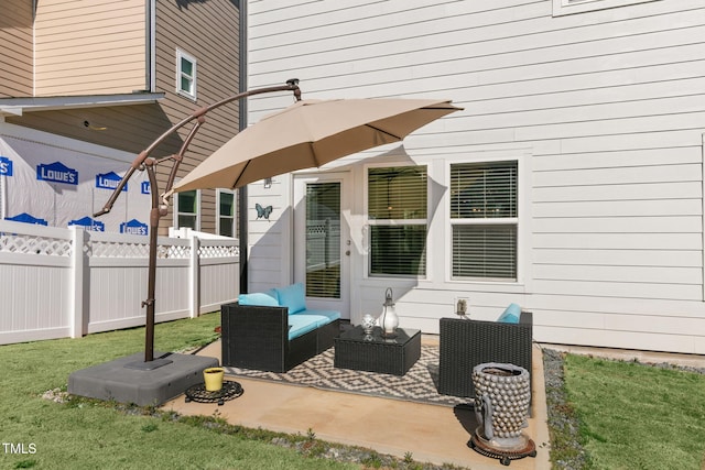 view of patio featuring fence and an outdoor hangout area