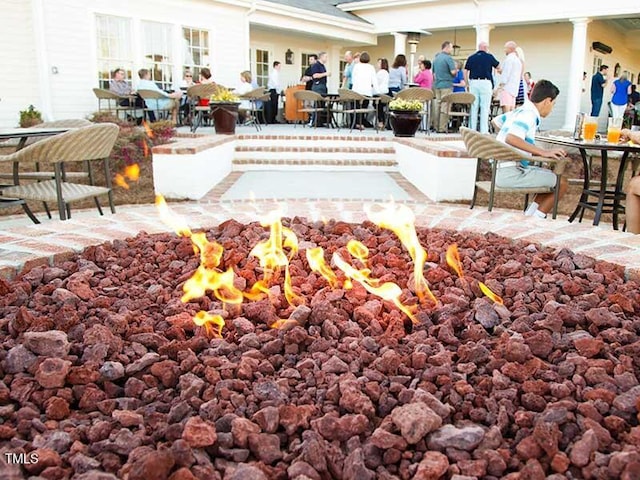 exterior space featuring a patio and a fire pit