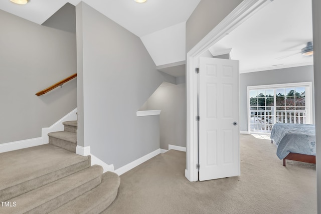 stairs with carpet flooring and baseboards