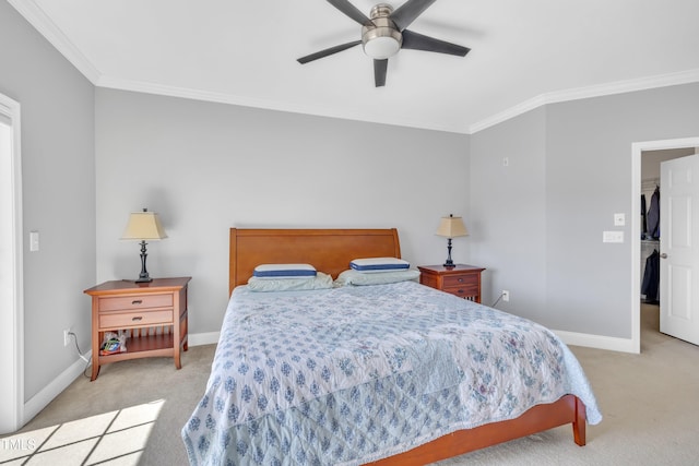 bedroom with a ceiling fan, crown molding, carpet, and baseboards