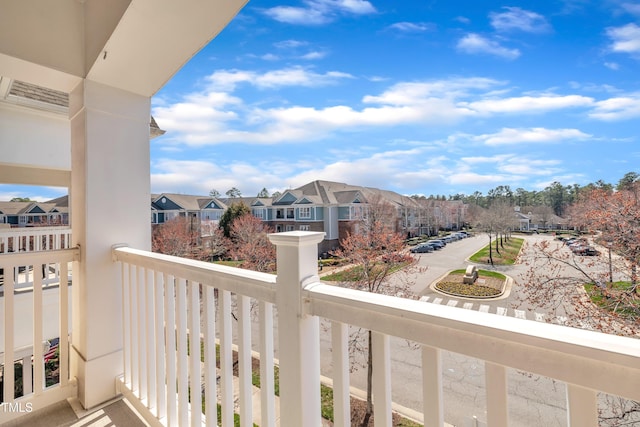 balcony featuring a residential view and visible vents