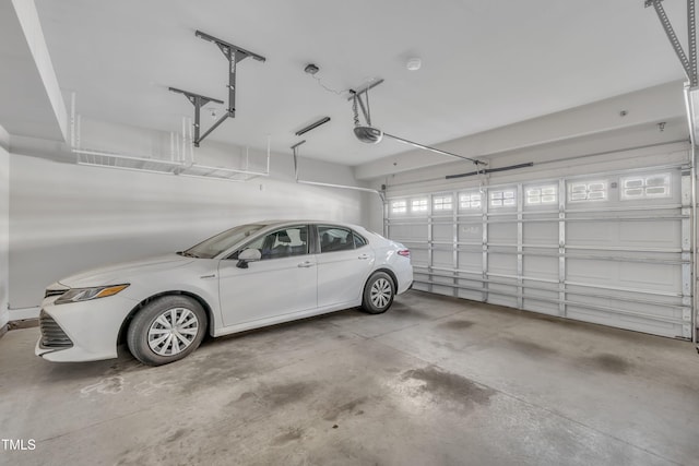 garage featuring a garage door opener