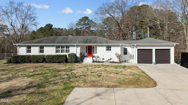 ranch-style home with an attached garage, concrete driveway, a front yard, and fence