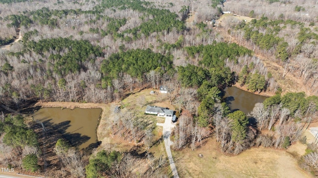 aerial view with a view of trees and a water view