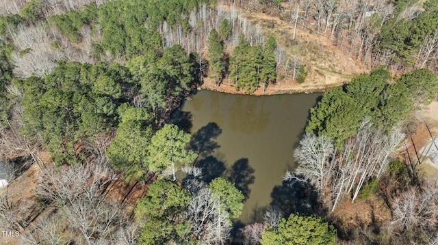 aerial view featuring a view of trees and a water view