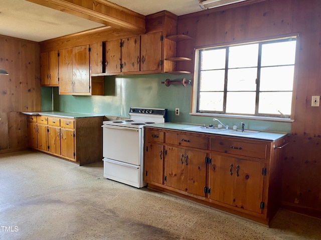 kitchen featuring open shelves, a sink, light countertops, white electric range, and brown cabinets