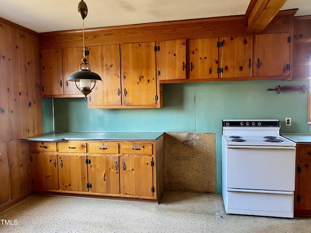 kitchen with light countertops, electric range, decorative light fixtures, and brown cabinets