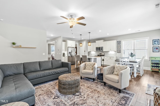 238 Ashpole Trl, Clayton, NC 27520 - living area with a ceiling fan, wood finished floors, and recessed lighting
