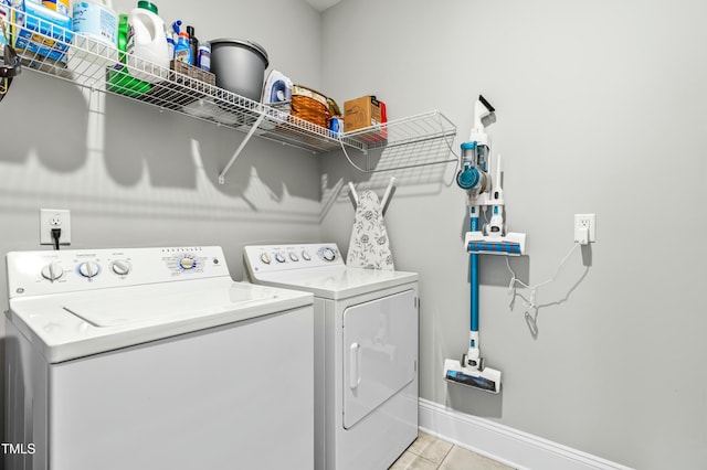 238 Ashpole Trl, Clayton, NC 27520 - laundry room with washer and dryer and light tile patterned flooring