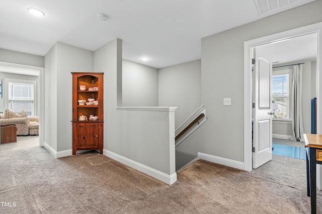 238 Ashpole Trl, Clayton, NC 27520 - hall with an upstairs landing, carpet, and recessed lighting