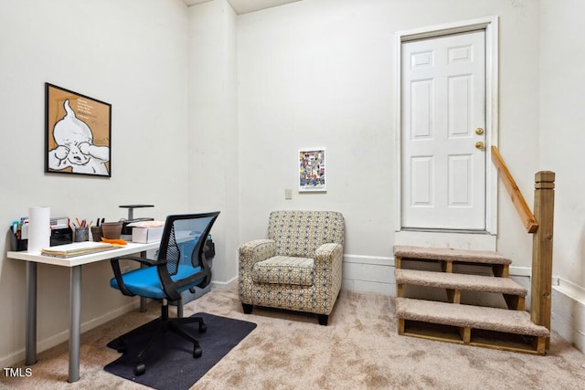 carpeted office featuring baseboards