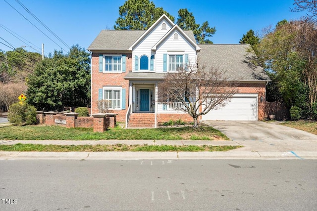 traditional home featuring concrete driveway, brick siding, and a shingled roof