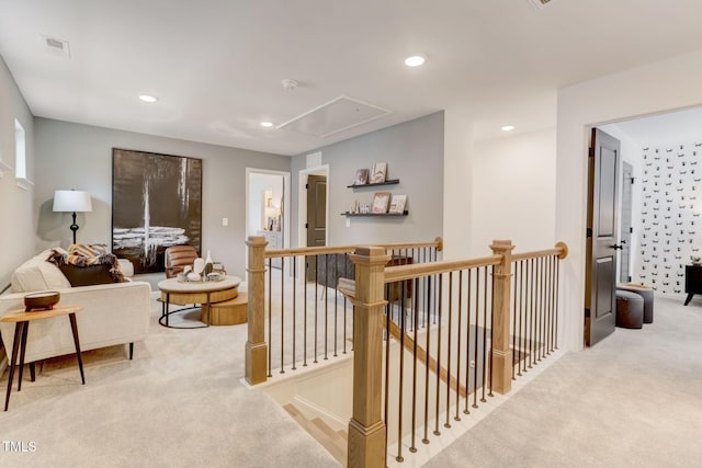 hall featuring an upstairs landing, recessed lighting, attic access, and carpet floors