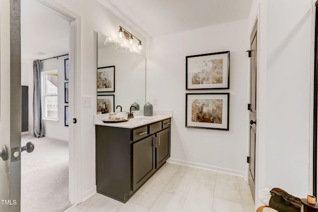 bathroom featuring vanity and baseboards