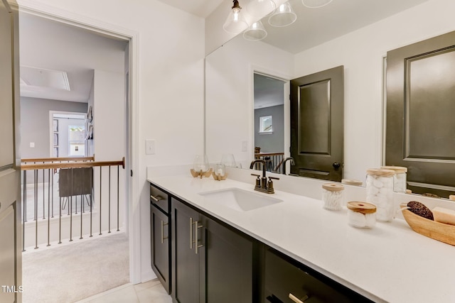 bathroom featuring tile patterned flooring and vanity