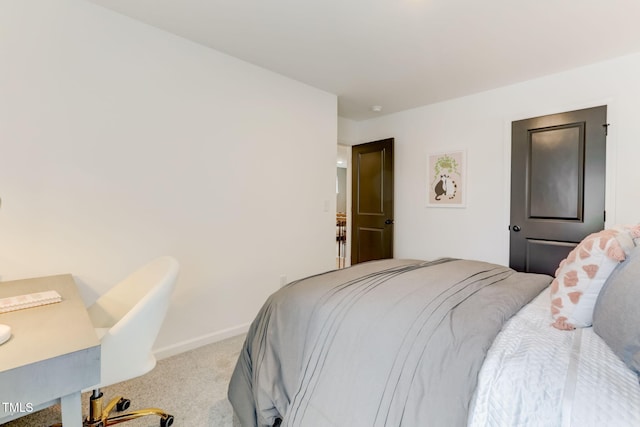 bedroom with baseboards and carpet flooring