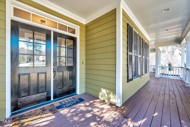 view of exterior entry featuring a porch