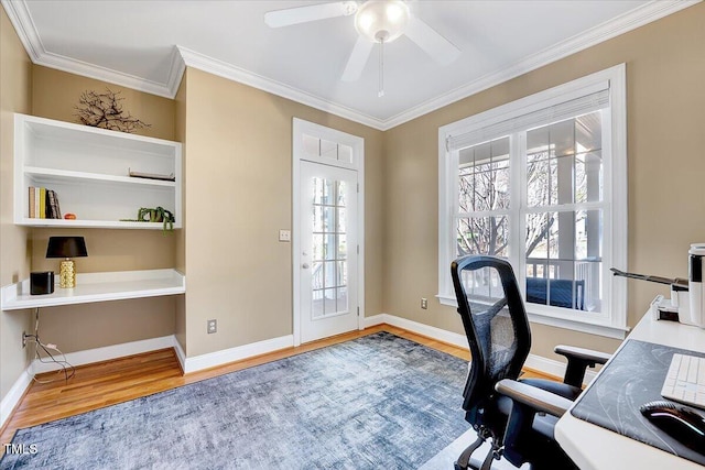 home office with ornamental molding, baseboards, a ceiling fan, and wood finished floors