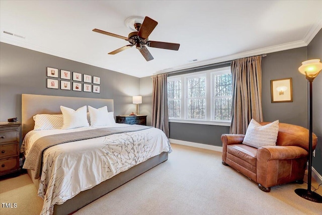 carpeted bedroom with visible vents, a ceiling fan, crown molding, and baseboards