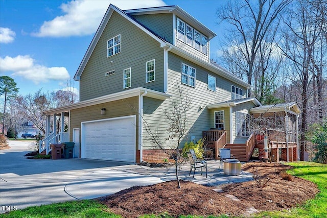 back of house featuring a garage