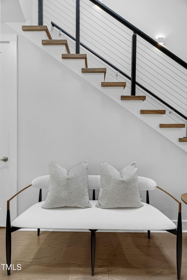 staircase featuring wood finished floors