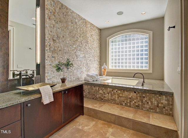 805 Greenwood Rd, Chapel Hill, NC 27514 - full bath featuring recessed lighting, vanity, stone tile floors, and a garden tub