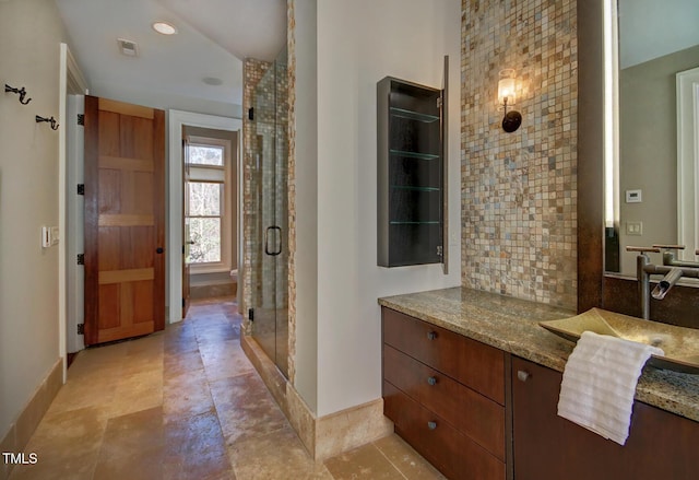 805 Greenwood Rd, Chapel Hill, NC 27514 - full bathroom with a shower stall, vanity, baseboards, and decorative backsplash
