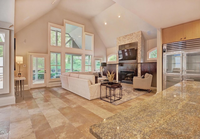805 Greenwood Rd, Chapel Hill, NC 27514 - living room featuring high vaulted ceiling, a fireplace, and baseboards