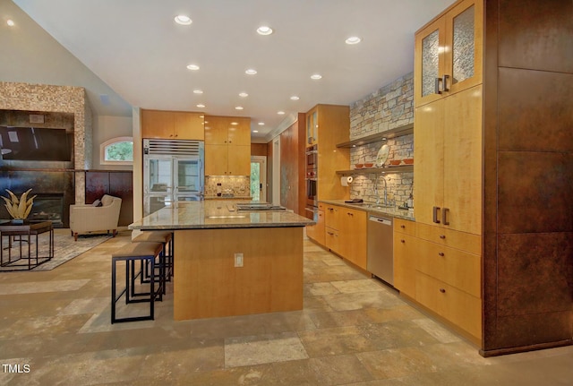 805 Greenwood Rd, Chapel Hill, NC 27514 - kitchen with recessed lighting, light stone countertops, backsplash, a kitchen island, and stainless steel appliances