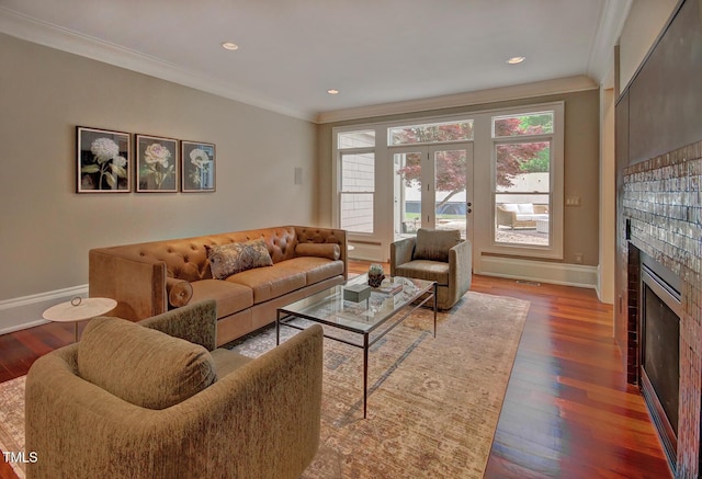 805 Greenwood Rd, Chapel Hill, NC 27514 - living area with a tile fireplace, baseboards, crown molding, and wood finished floors