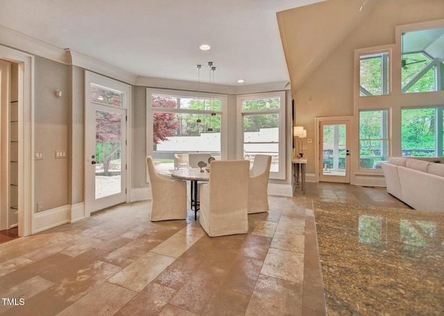 805 Greenwood Rd, Chapel Hill, NC 27514 - unfurnished dining area featuring recessed lighting, baseboards, and stone tile flooring