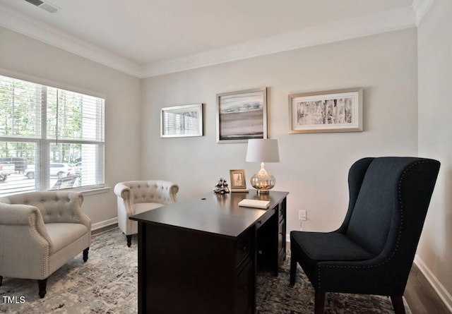 home office with visible vents, baseboards, and crown molding