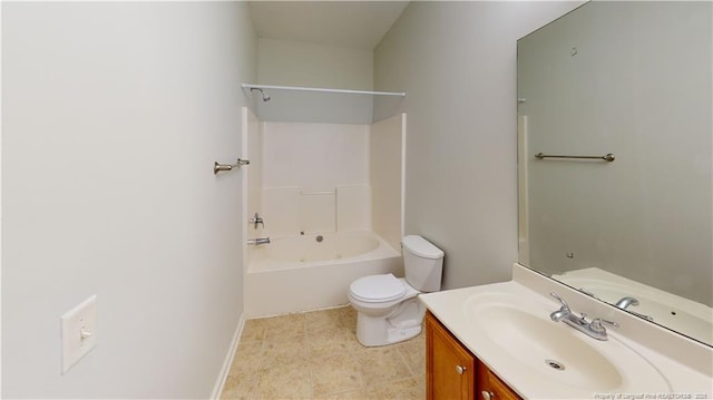 bathroom with toilet, vanity, and  shower combination